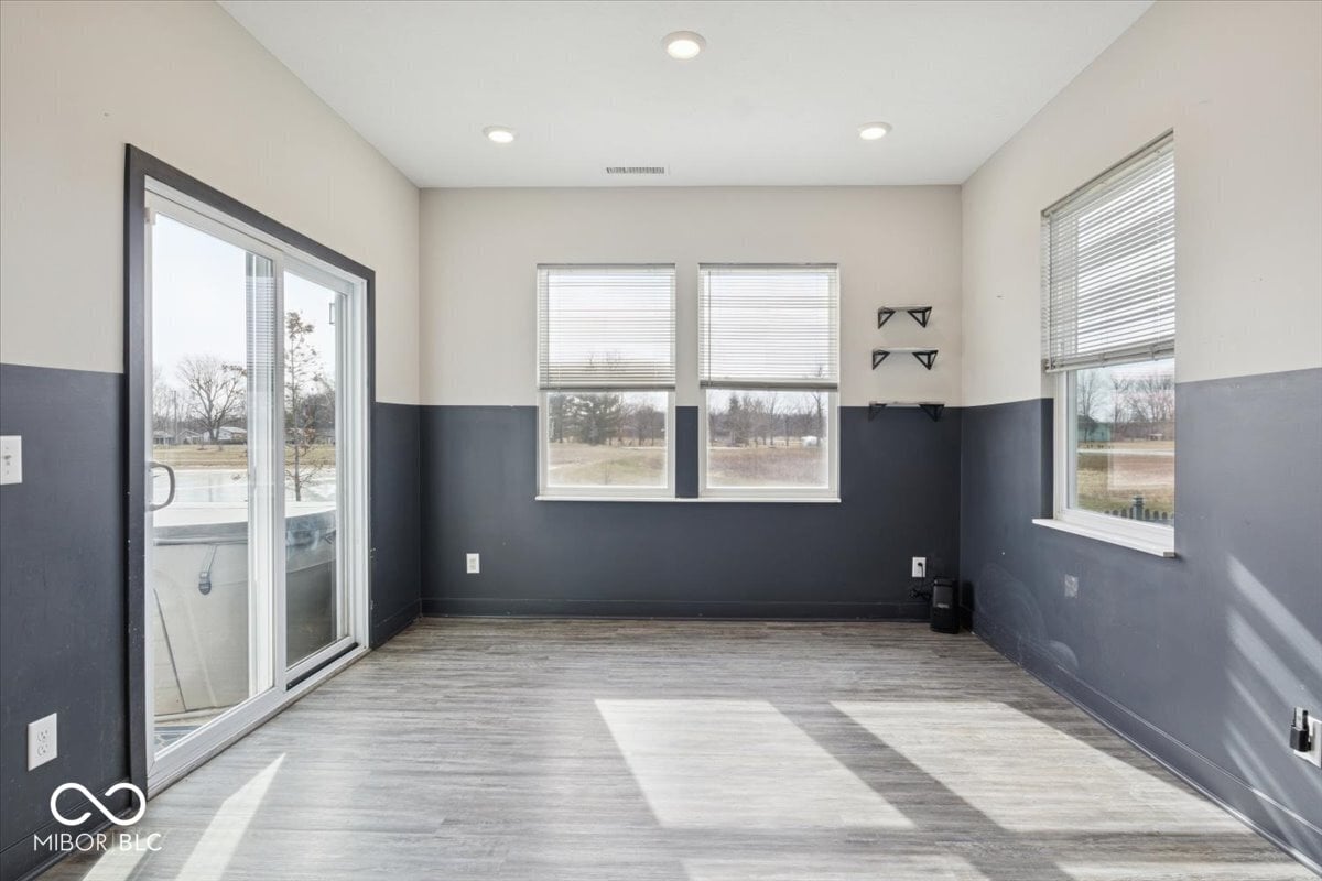 Bright open space with modern finishes and patio access.