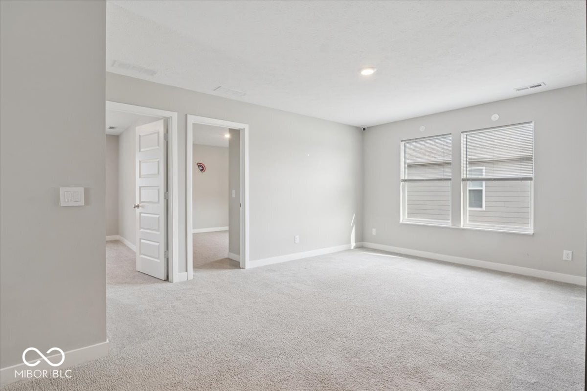 Spacious primary suite with ensuite bath and natural light.