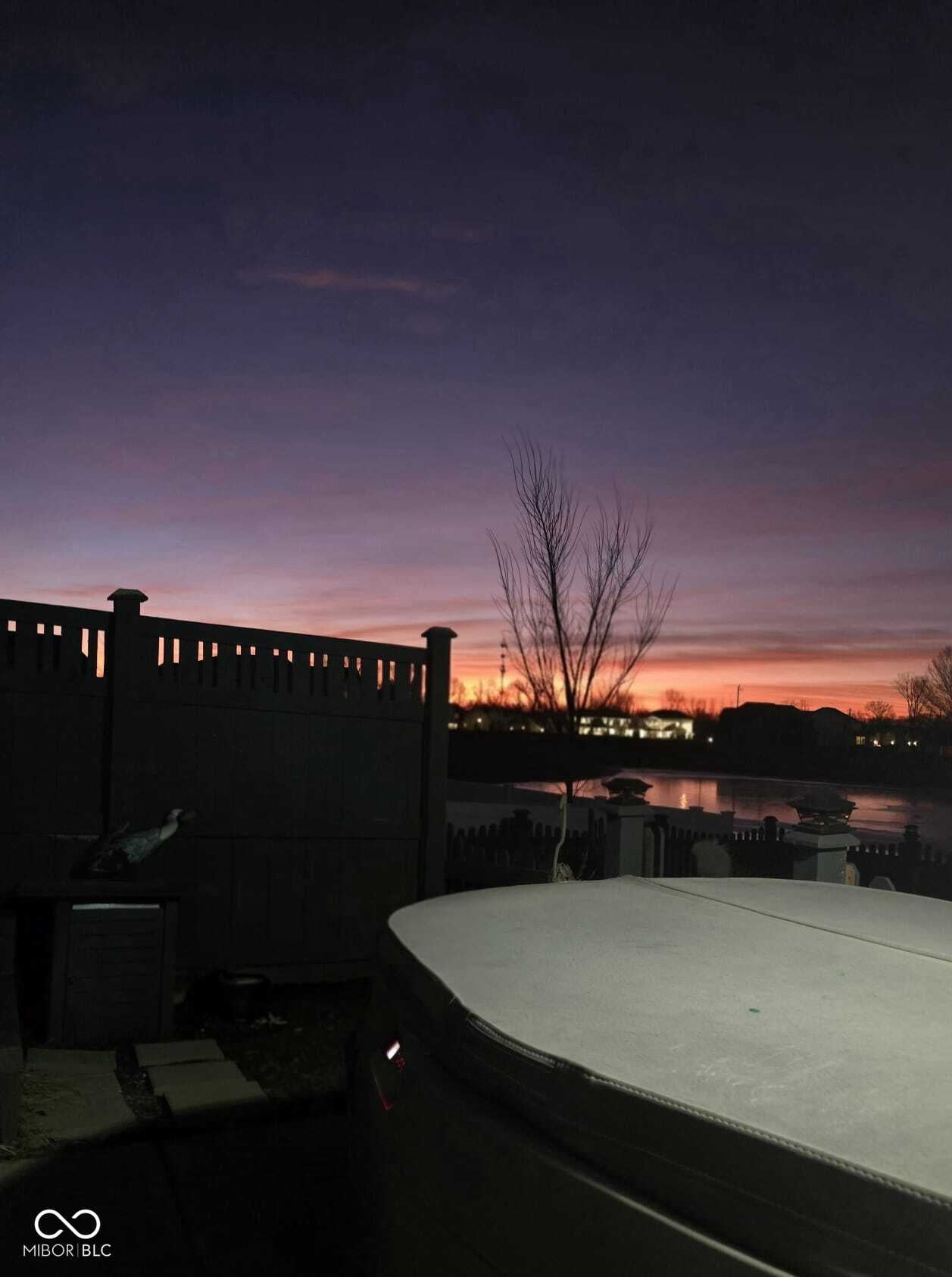 Stunning waterfront deck with golden sunset views.