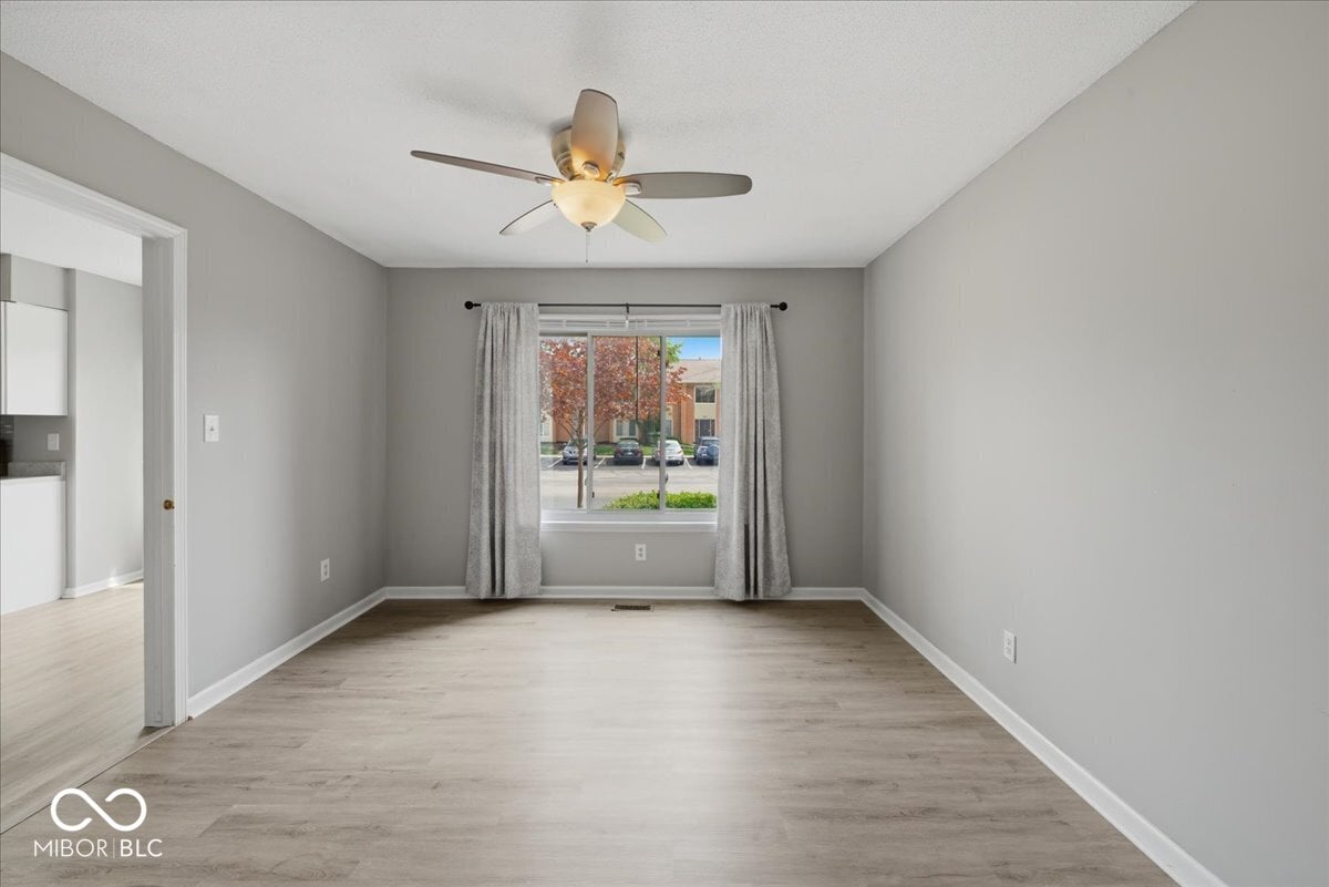 Bright, updated living space with hardwood floors and natural light.