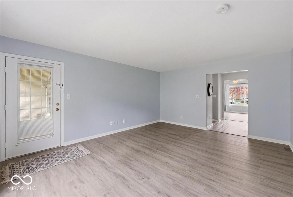 Bright open family room with updated laminate flooring.