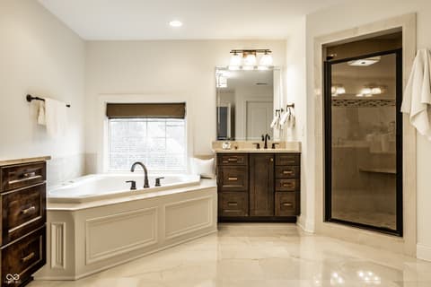 Primary bathroom at 13429 Boxelder Court, Carmel, IN — Luxurious primary bath with soaking tub and walk-in shower.
