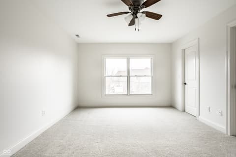 Bedroom at 13429 Boxelder Court, Carmel, IN — Bright, spacious bedroom with abundant natural light.
