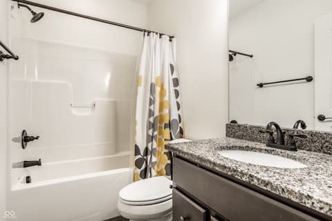 Bathroom at 13429 Boxelder Court, Carmel, IN — Updated bathroom with granite counters and double vanity.