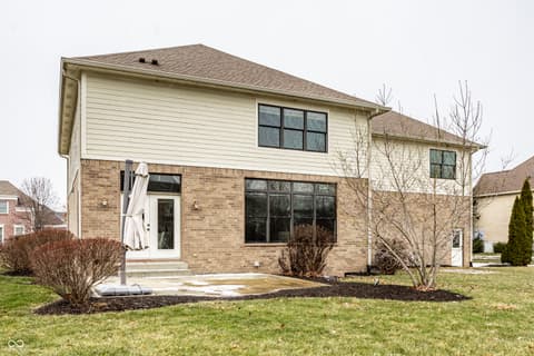Backyard at 13429 Boxelder Court, Carmel, IN — Spacious backyard with updated exterior and patio area.