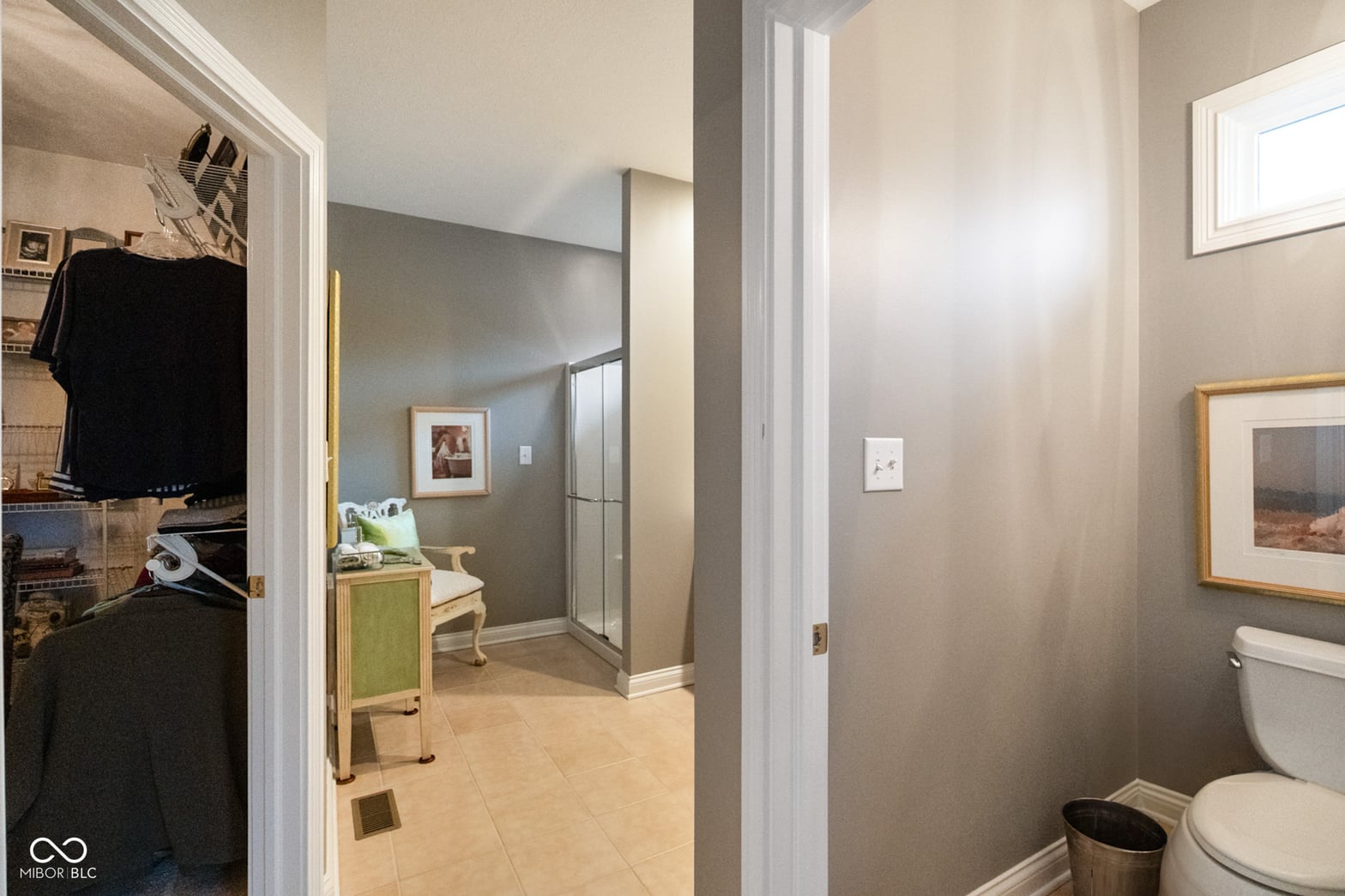 Modern primary bath with generous walk-in shower.
