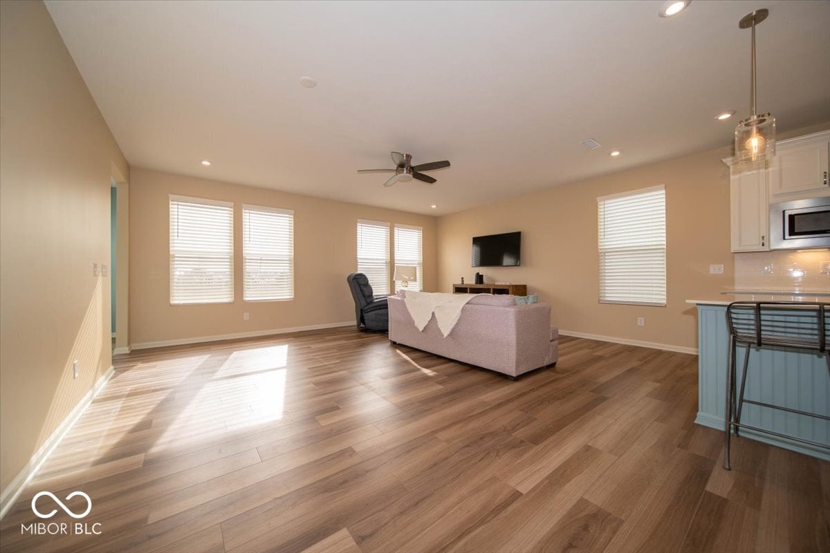Bright open family room with premium hardwood flooring.
