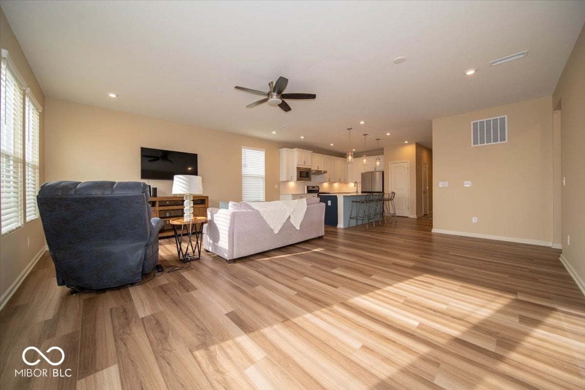 Spacious open concept with premium hardwood flooring throughout.