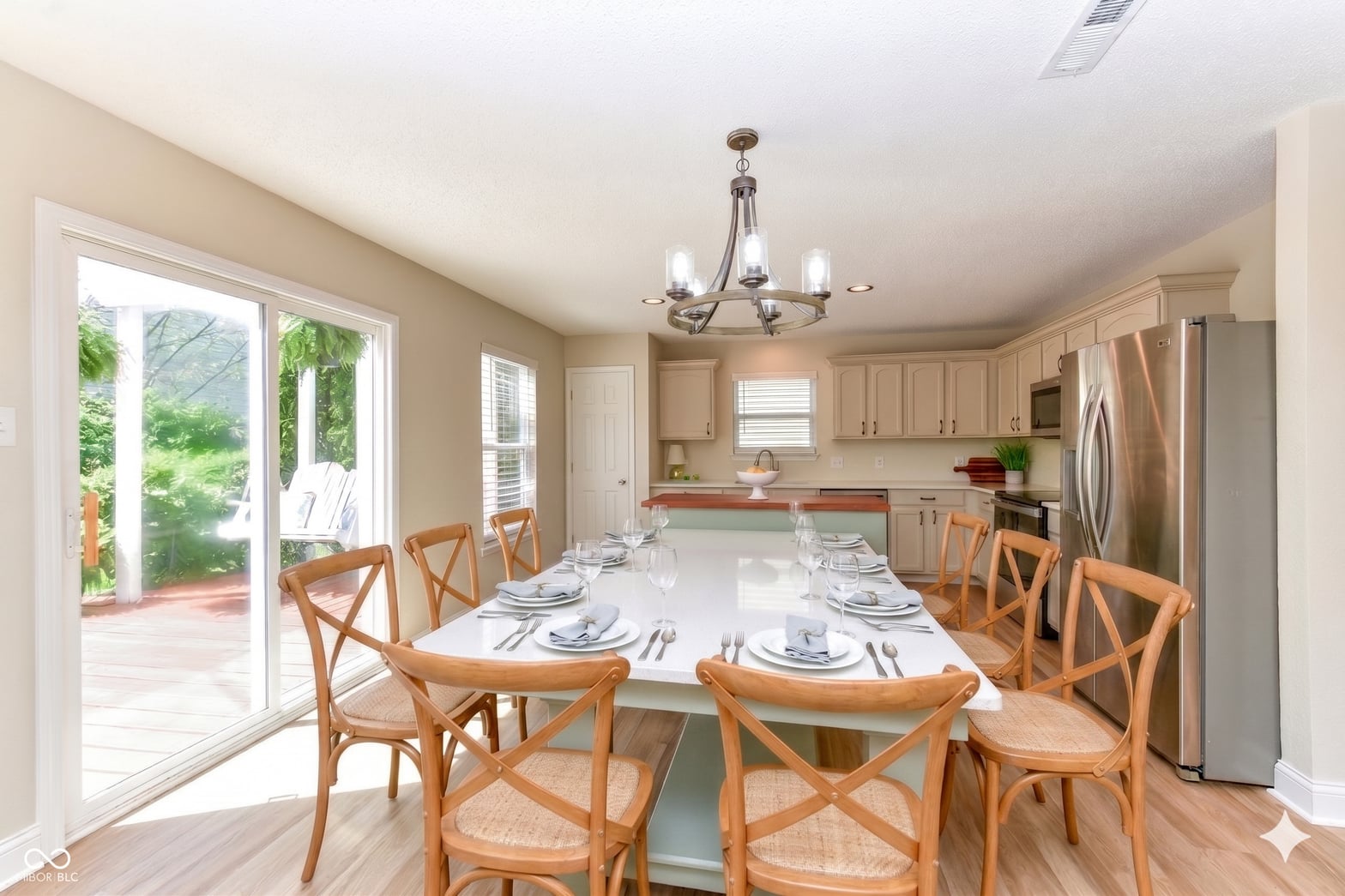 Bright open kitchen-dining with garden views and modern updates.