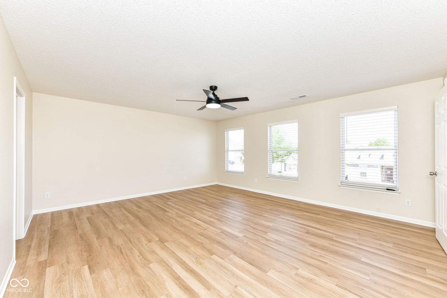 Bright, spacious room with beautiful hardwood floors throughout.