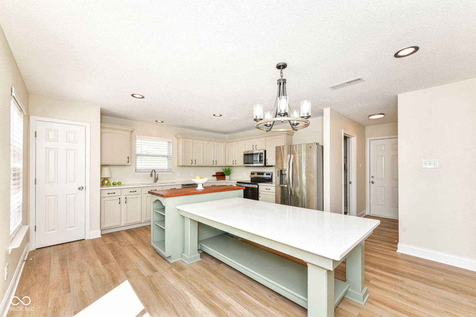 Spacious kitchen with large island and updated finishes.