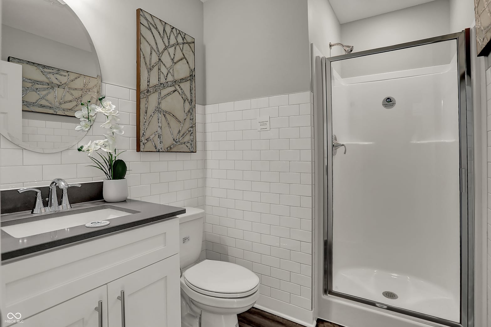 Modern primary bath with subway tile and clean finishes.