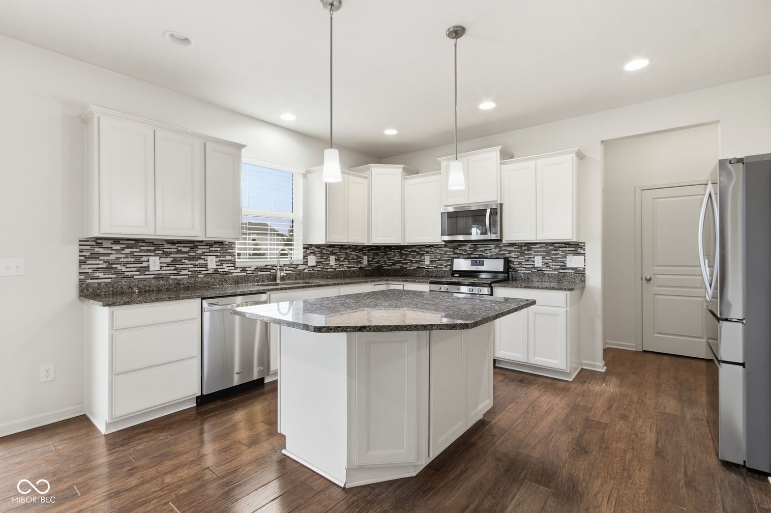 Bright modern kitchen with island and premium finishes.