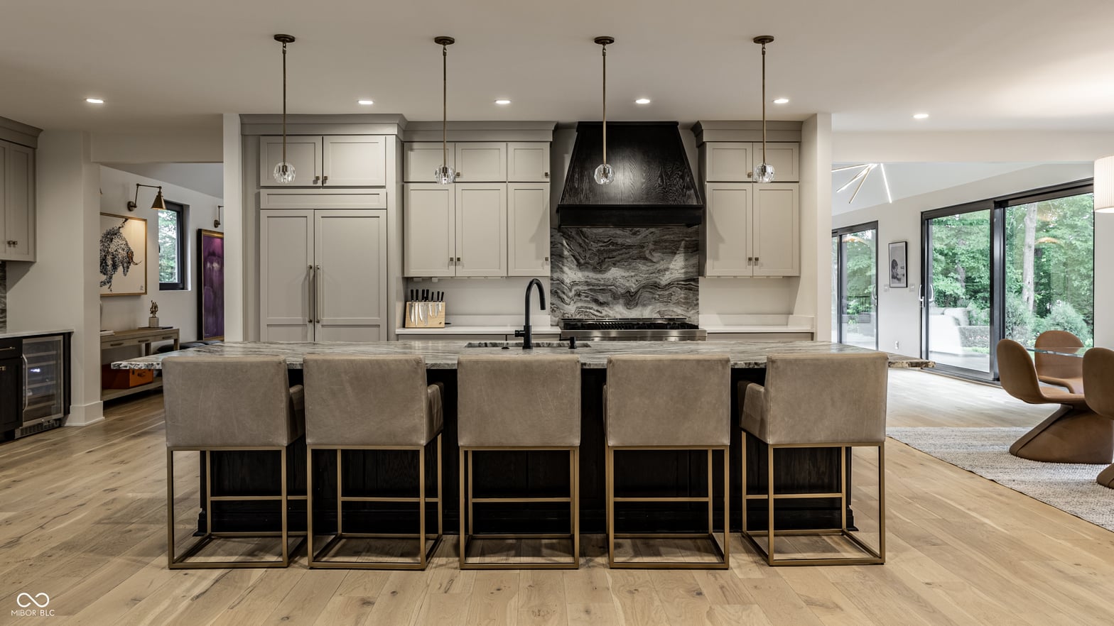 Modern kitchen with dramatic marble backsplash and large island.