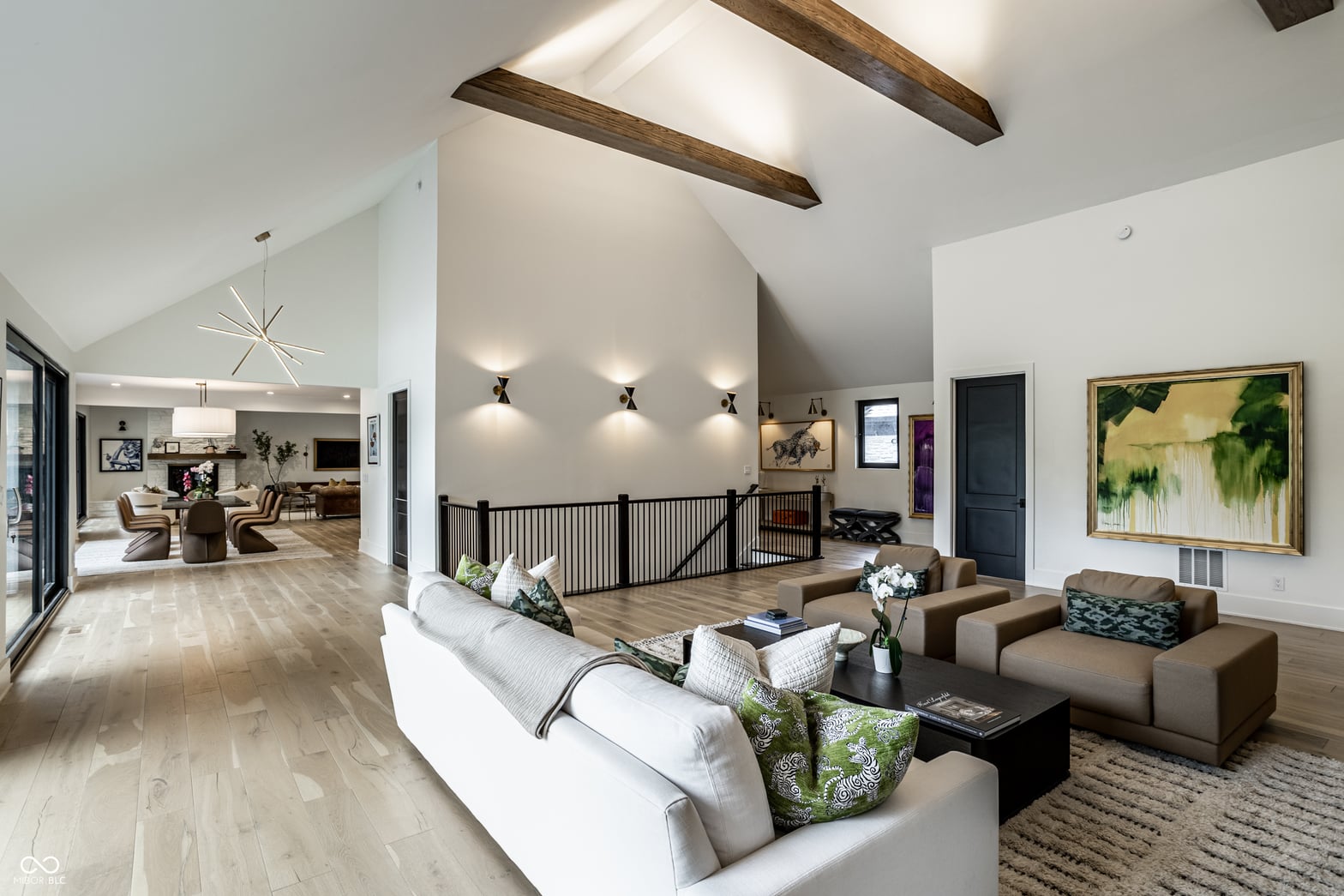Bright modern family room with vaulted ceilings and exposed beams.