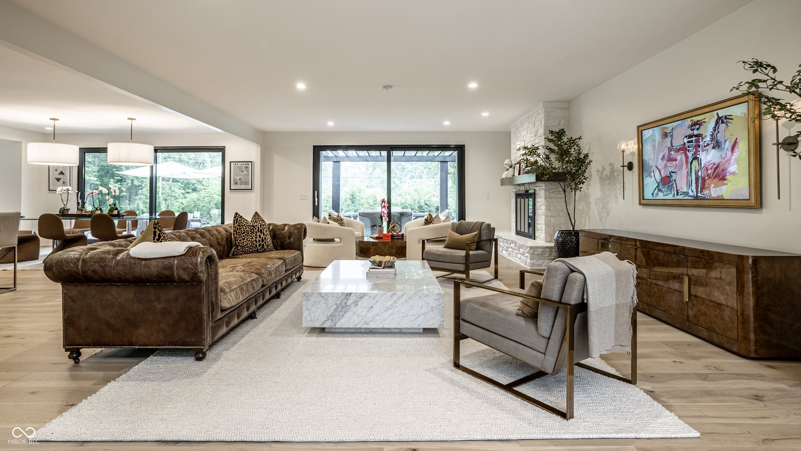 Spacious contemporary living room with marble centerpiece.