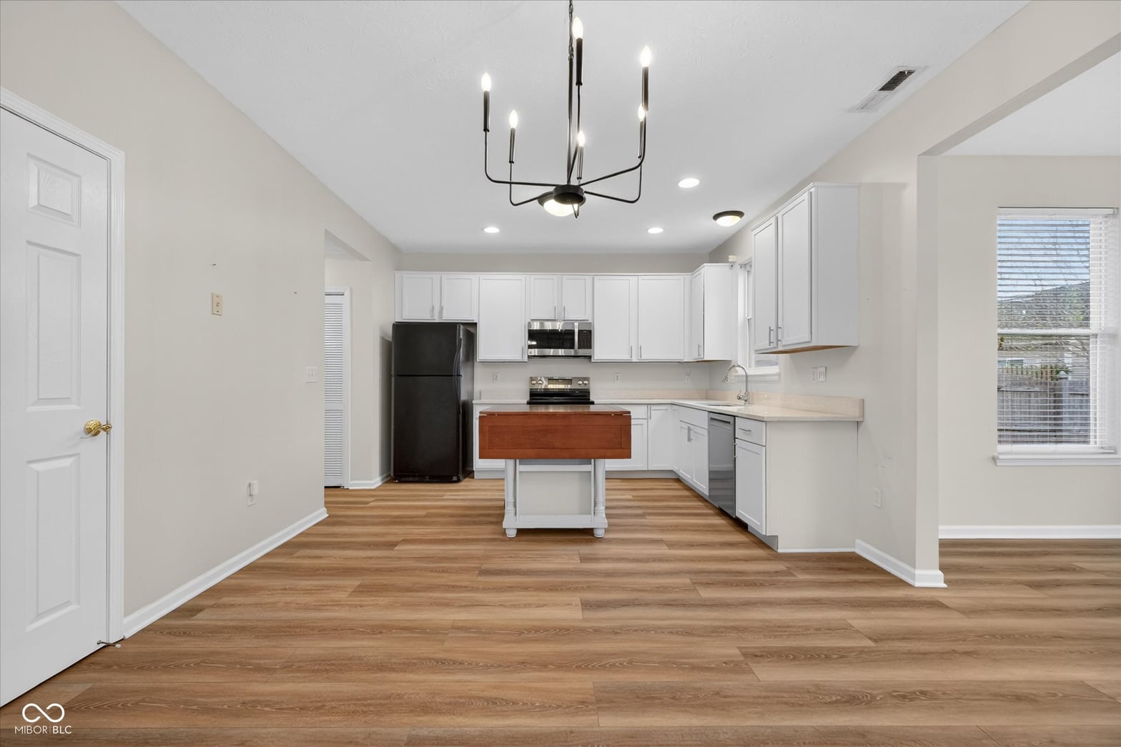 Bright updated kitchen with island and modern finishes.