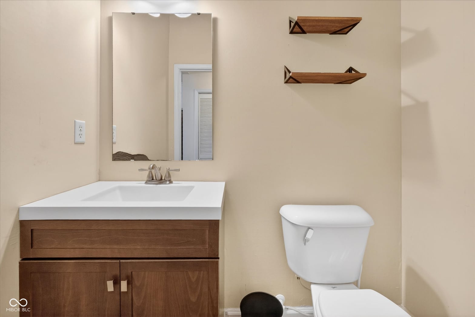 Clean, updated bathroom with modern vanity and ample storage.