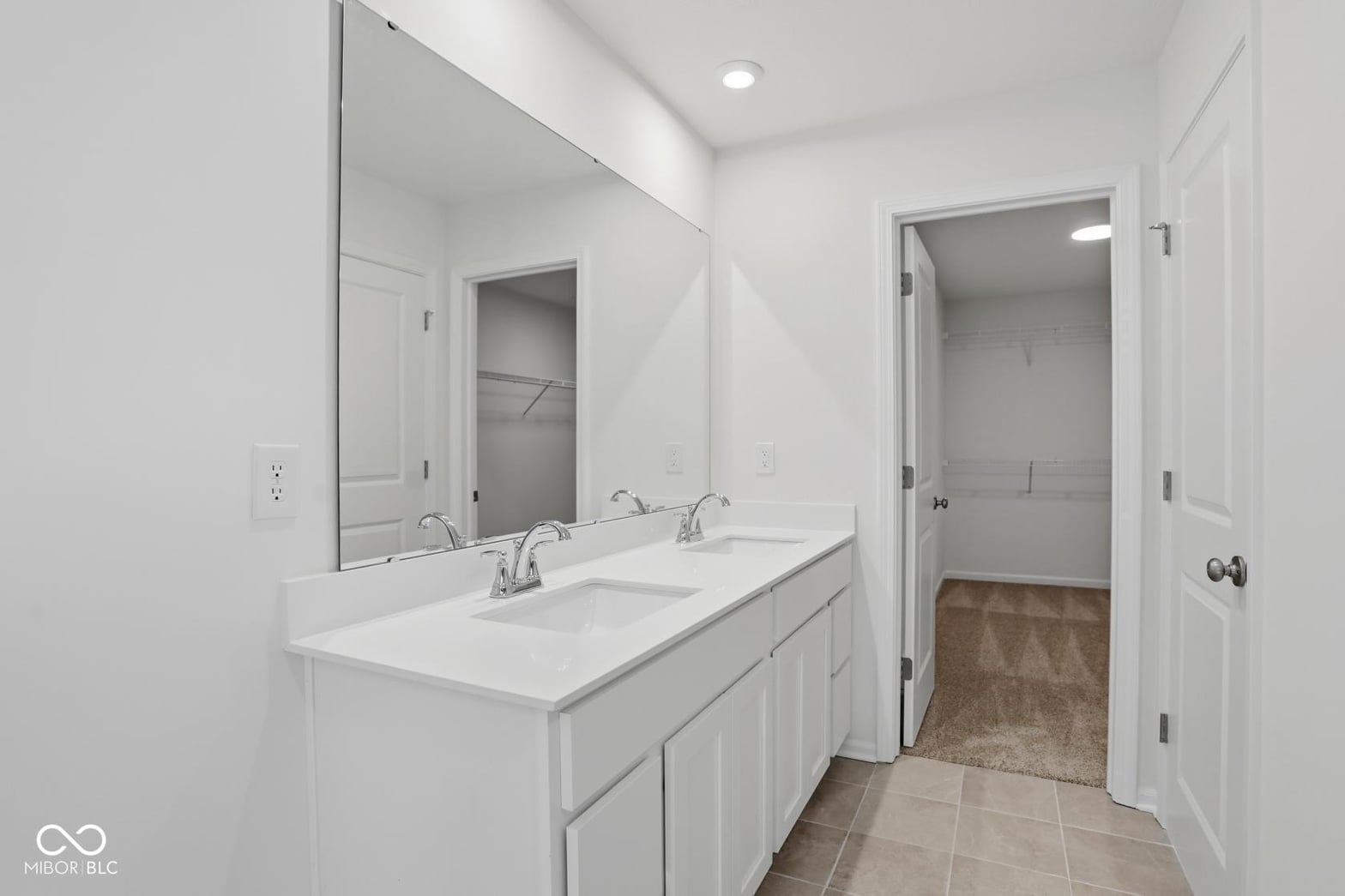 Bright modern primary bath with spacious double vanity.