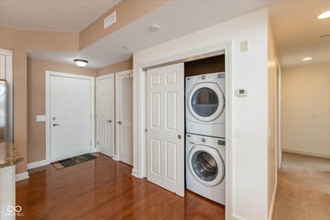 Laundry room at 20971 Shoreline Court, Noblesville, IN — Spacious laundry room with stacked front-load appliances.