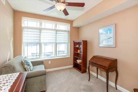 Bedroom at 20971 Shoreline Court, Noblesville, IN — Bright bedroom with expansive windows and natural light.