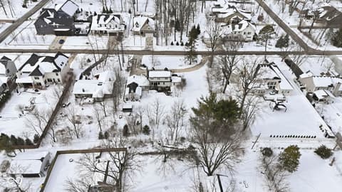 Aerial view at 1025 Oswego Road, Carmel, IN — Charming wooded lot in established, tree-lined neighborhood.