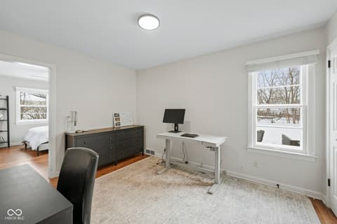 Home office at 1025 Oswego Road, Carmel, IN — Bright office space with abundant natural light and storage.