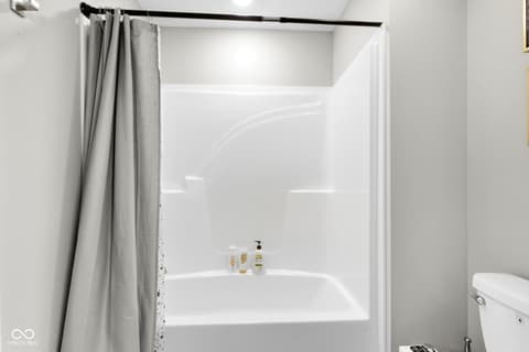Bathroom at 15546 Senita Lane, Fishers, IN — Clean, updated bathroom with modern tub surround.