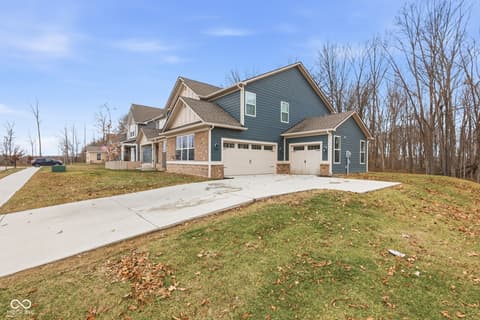 Front exterior at 15546 Senita Lane, Fishers, IN — New construction home with spacious lot and two-car garage.