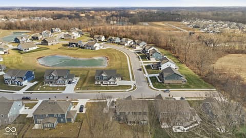 Aerial view at 15546 Senita Lane, Fishers, IN — New construction community with pond and spacious lots.