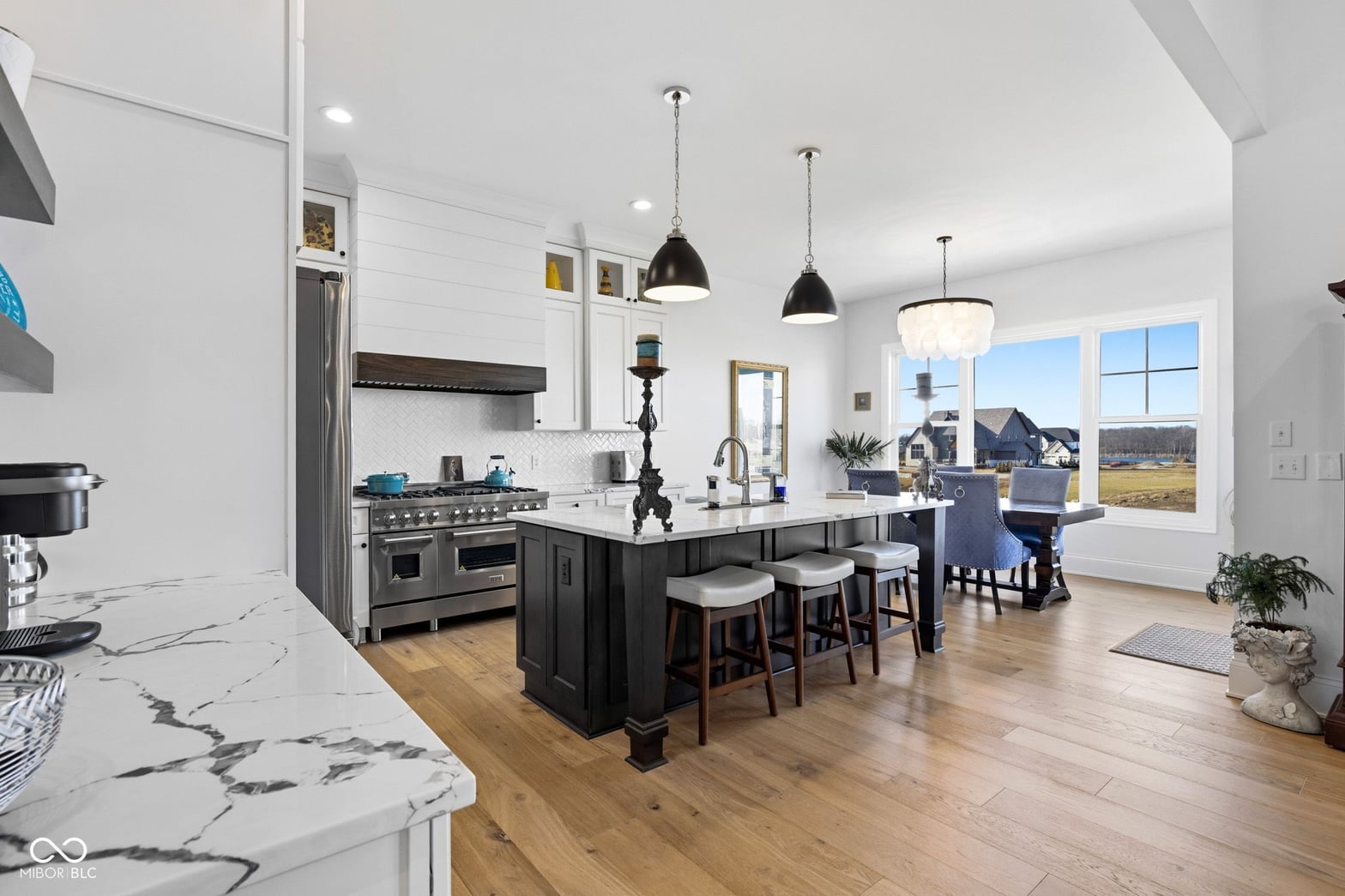 Stunning contemporary kitchen with professional appliances and views.