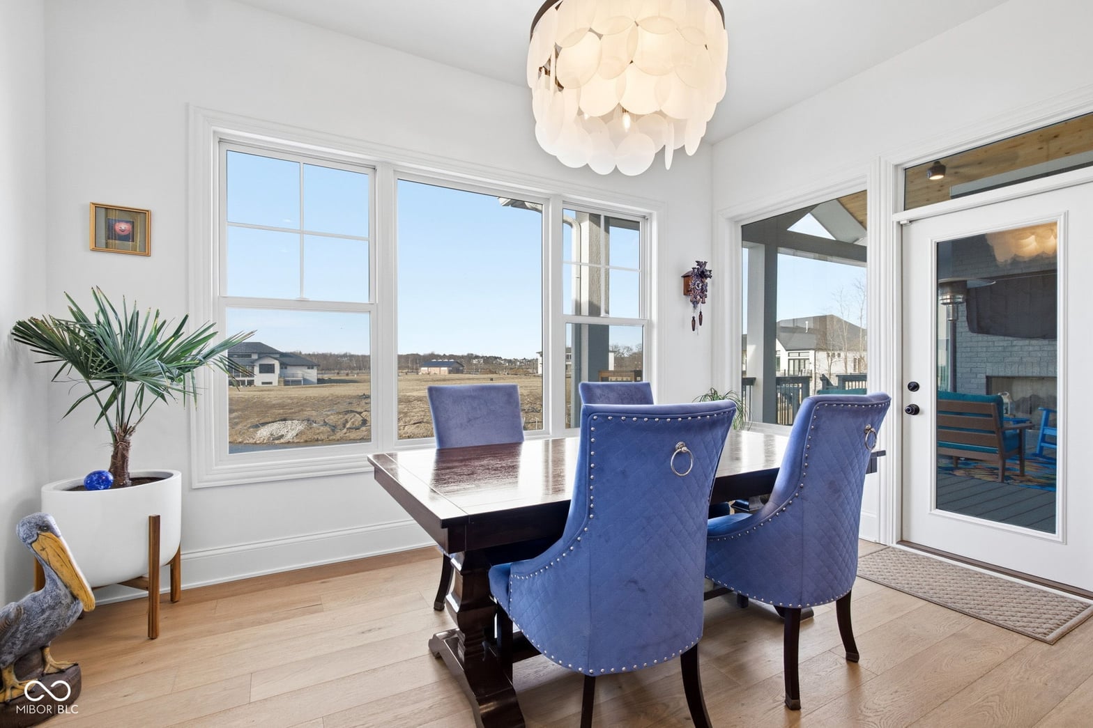 Bright dining area with expansive countryside views and modern finishes.