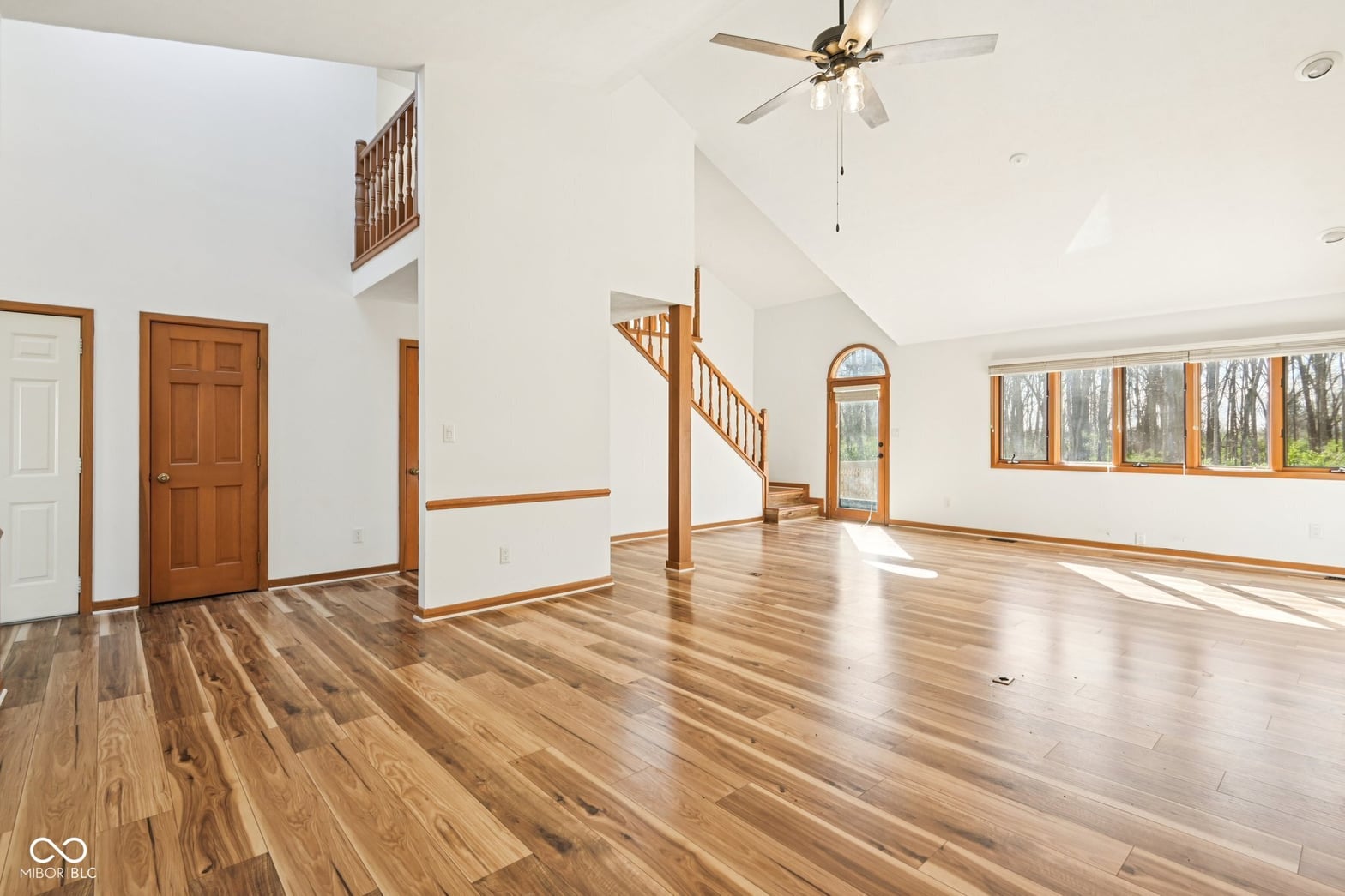 Bright open family room with soaring vaulted ceilings.