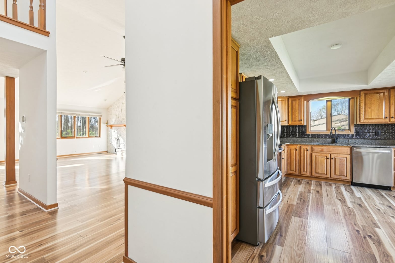 Spacious kitchen with wood cabinetry and stainless steel appliances.