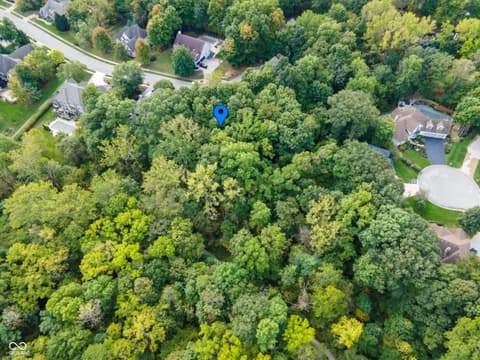 Aerial view at 13562 Creekridge Lane, Fishers, IN — Secluded wooded lot in established residential neighborhood.