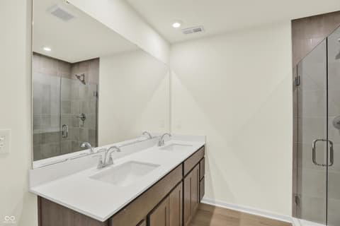 Primary bathroom at 3944 E 191st Street, Westfield, IN — Spacious primary bath with dual vanity and frameless shower.
