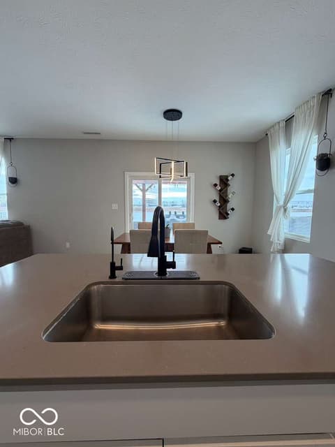 Kitchen at 19994 Edwick Drive, Westfield, IN — Modern kitchen with spacious island and water views.
