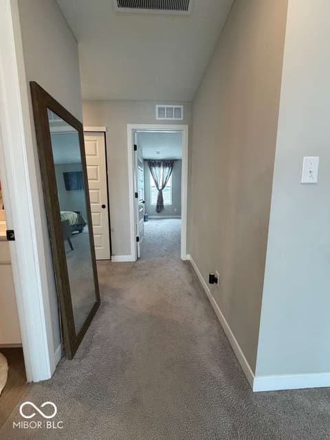 Hallway at 19994 Edwick Drive, Westfield, IN — Spacious hallway with neutral finishes and clean sightlines.