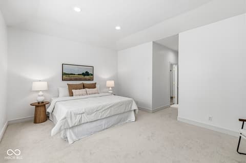 Primary bedroom at 10380 Spring Highland Drive, Indianapolis, IN — Spacious primary bedroom with ensuite and modern finishes.
