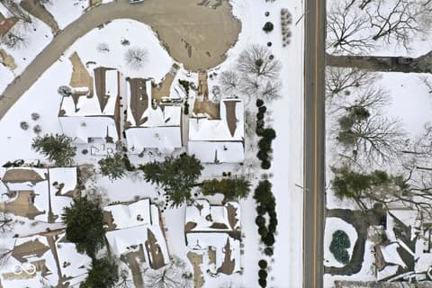 Aerial view at 10380 Spring Highland Drive, Indianapolis, IN — Expansive property with mature landscaping and curved drive.