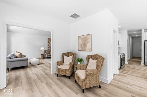 Living room at 10380 Spring Highland Drive, Indianapolis, IN — Bright contemporary living space with hardwood flooring.