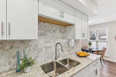 Kitchen at 38 Homestead Drive, Sheridan, IN — Bright updated kitchen with marble and granite finishes.