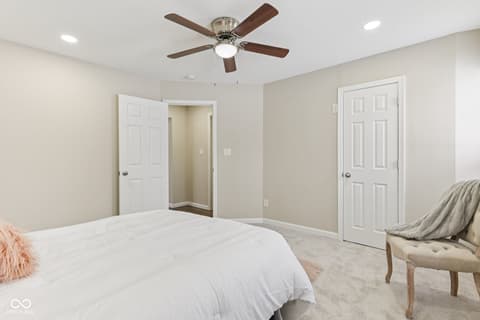 Primary bedroom at 38 Homestead Drive, Sheridan, IN — Spacious primary bedroom with dual closets and ceiling fan.