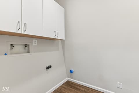 Laundry room at 38 Homestead Drive, Sheridan, IN — Bright, modern laundry room with utility sink and storage.