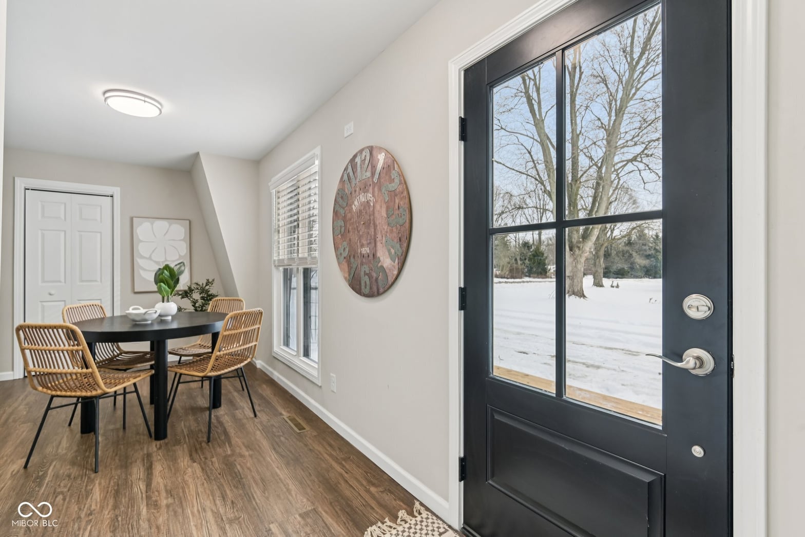 Dining room at 38 Homestead Drive, Sheridan, IN — Bright modern dining with views of snowy landscape.