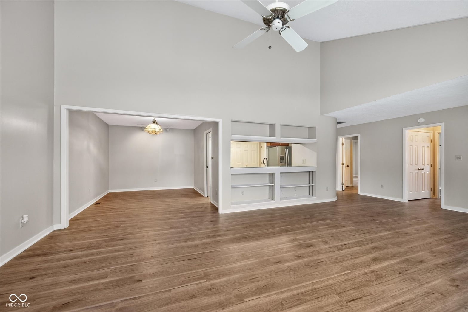 Spacious open concept with vaulted ceilings and built-ins.