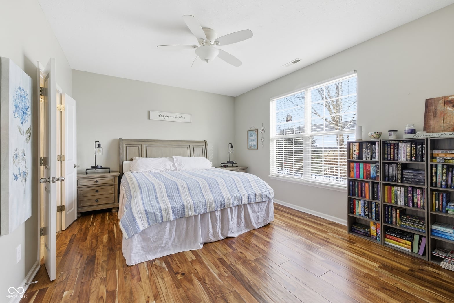 Spacious primary bedroom with abundant natural light and storage.
