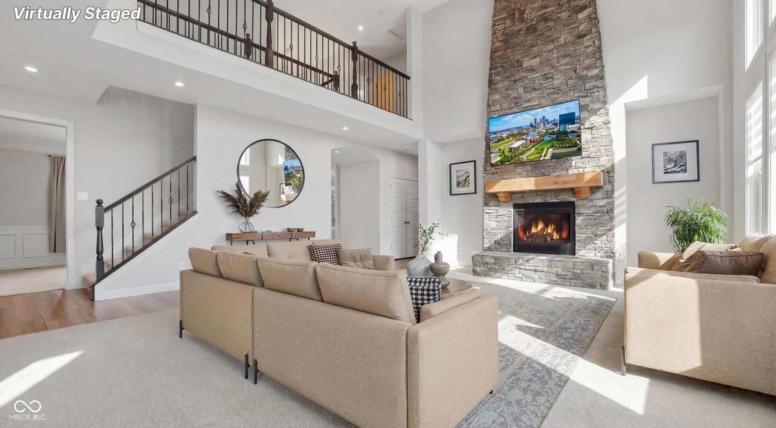 Stunning two-story living with stone fireplace and loft.