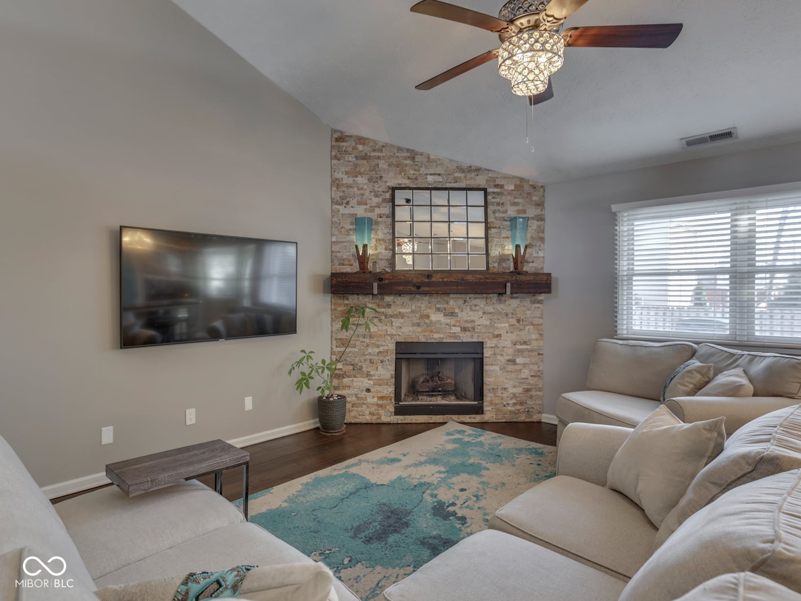Elegant family room with brick fireplace and modern finishes.