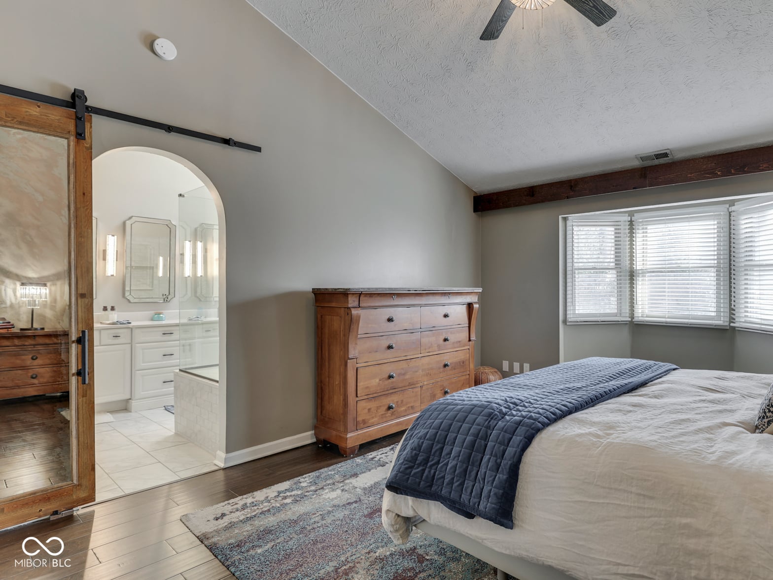 Spacious primary suite with attached spa-like bathroom.